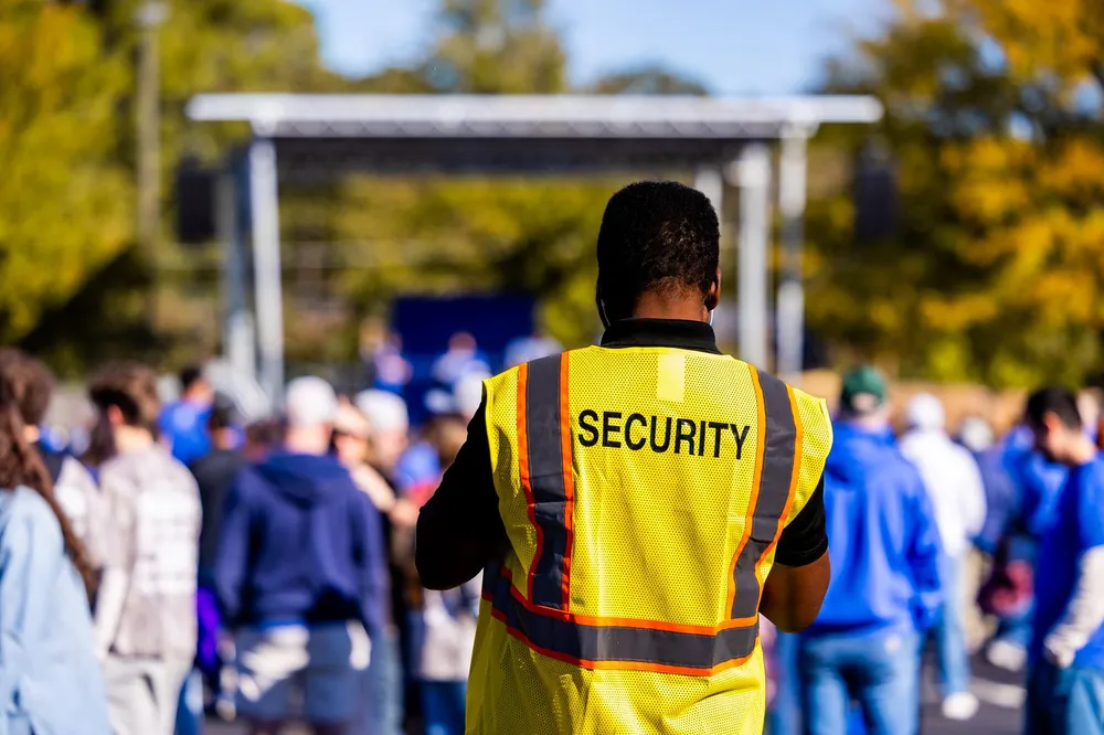 EST crew member in uniform vest